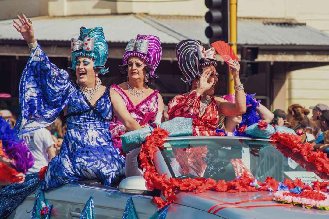 photo of three women riding car