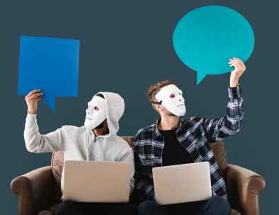 two men using white laptop computer sitting on brown wooden sofa