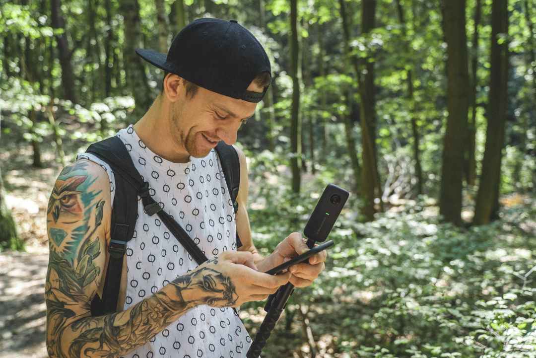 smiling holding smartphone